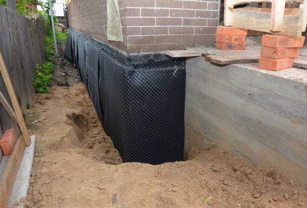 SJ Waterproofing Pros technician performing targeted Emergency Waterproofing assessment in Liverpool, NY